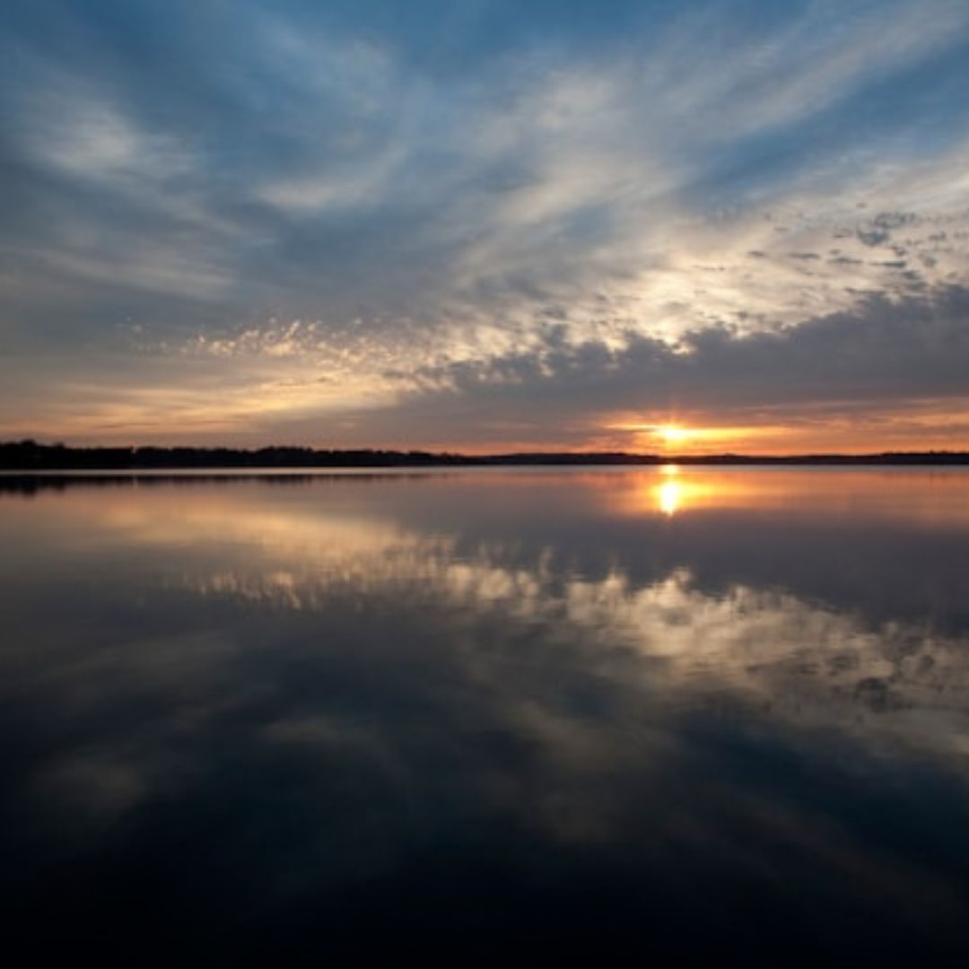Sunset on the horizon over the water