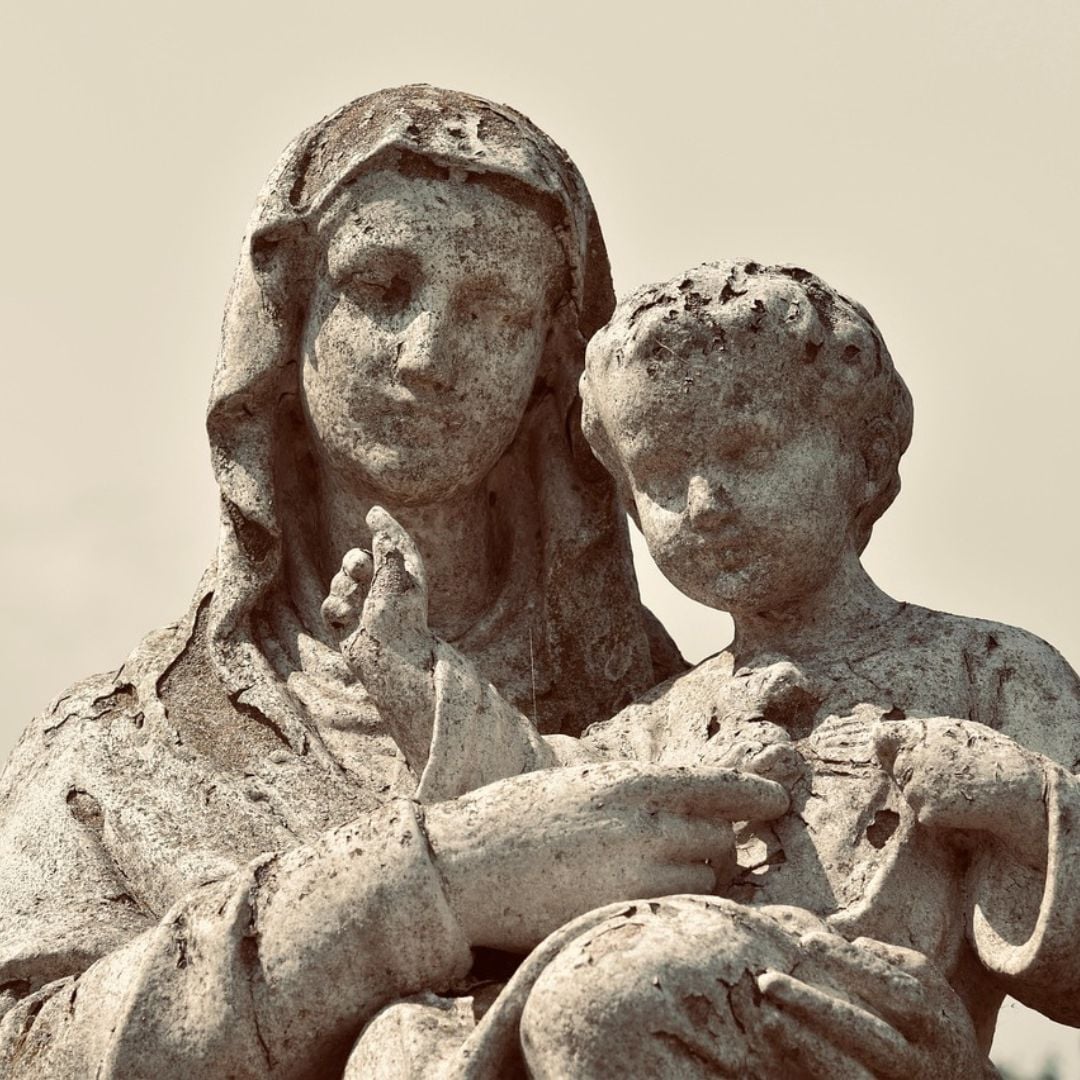 stone statue of Mary holding baby Jesus