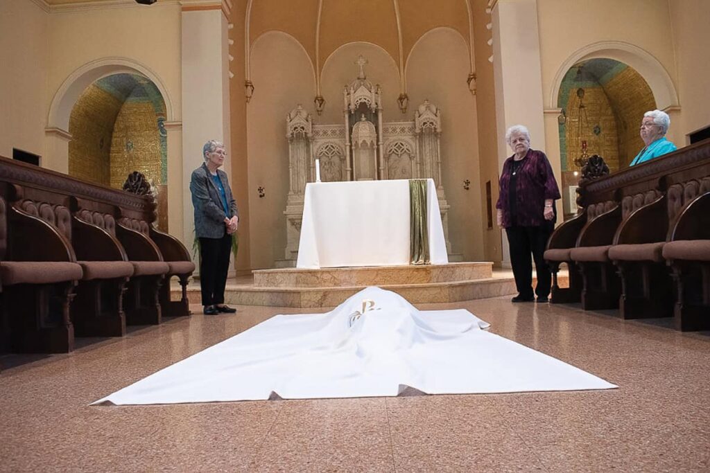 Sister Helga is covered with a pall as a sign of her mystical burial with Christ and rising to a new life.