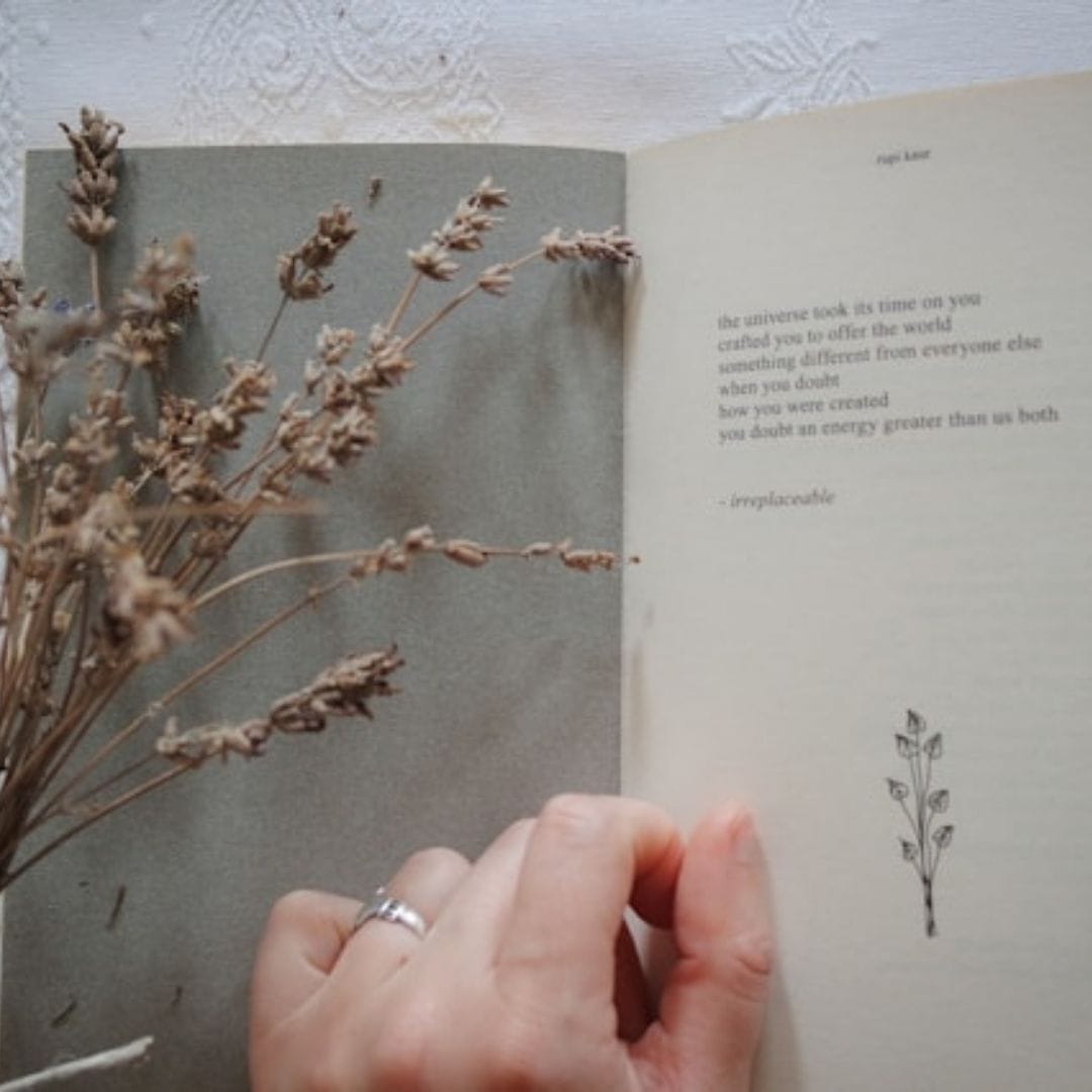 open book of poetry with flowers